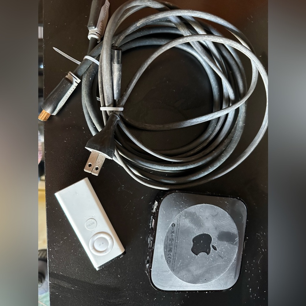Apple Black TV Media Player with White Remote and Black Cables